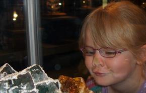 girl looking at the minerals