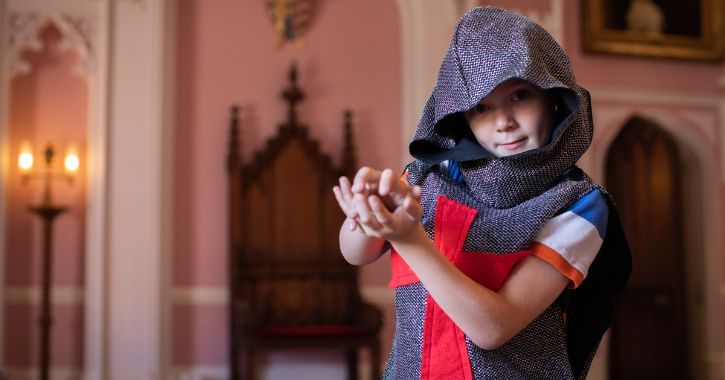 A young boy dressed in Knights clothing