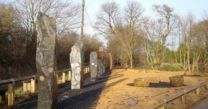 Timescale sculpture showing slate monoliths, boulders of 'coal' and Davy lamps