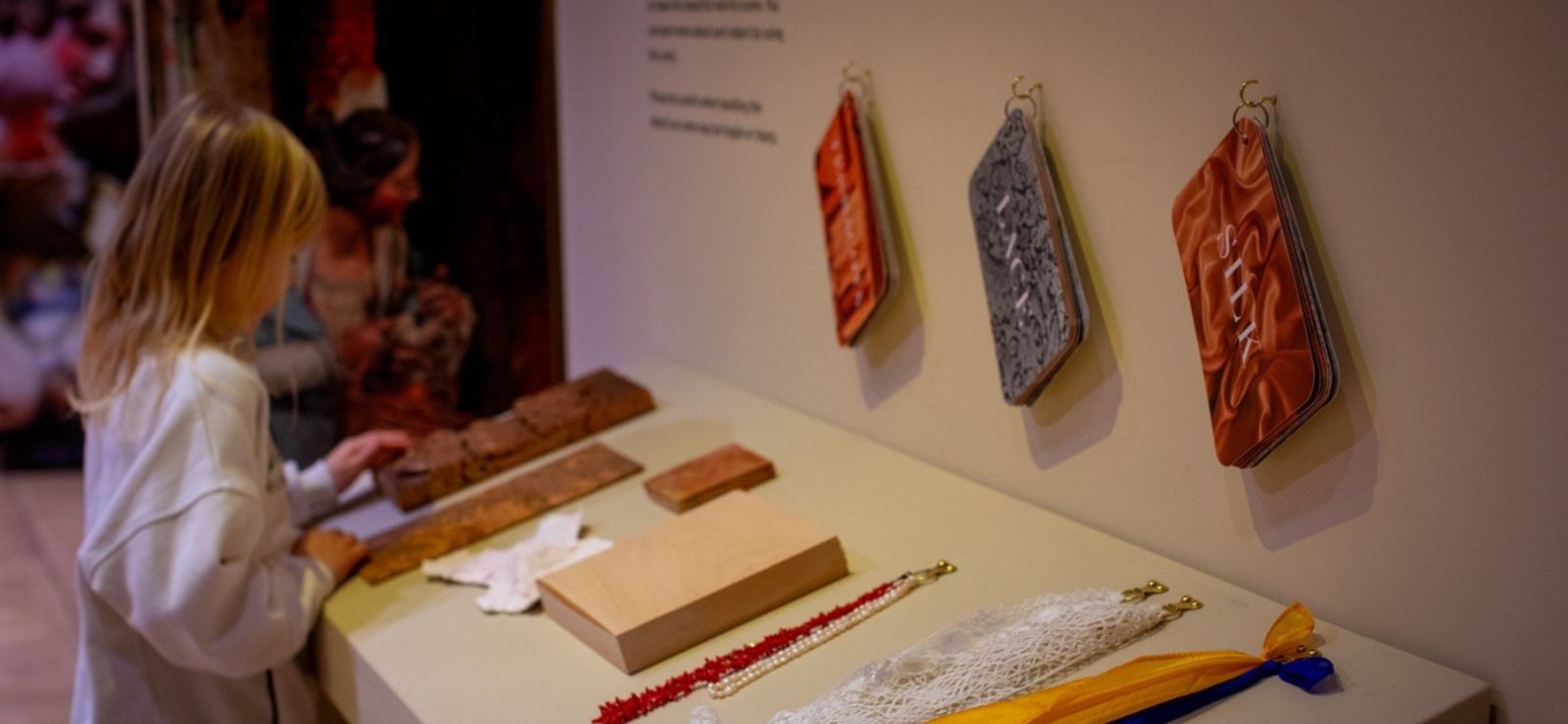 A girl looking at an exhibition at Auckland Palace