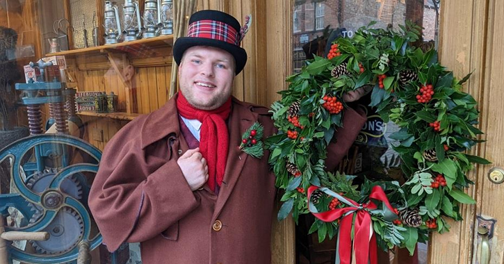 A man in traditional christmas clothing at Beamish
