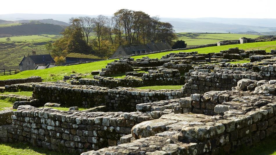 Image of Housesteads Roman Fort and rolling hills in the background. English Heritage.