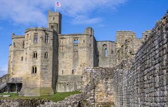 Exterior image of Warkworth Castle on a sunny day - English Heritage