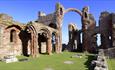 Image of Lindisfarne Priory on a sunny day - English Heritage.