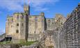 Exterior image of Warkworth Castle on a sunny day - English Heritage