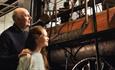 Grandad and Granddaughter looking at Locomotion