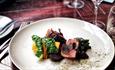 A beautifully presented plate of meat and vegetables from the a la Carte Menu