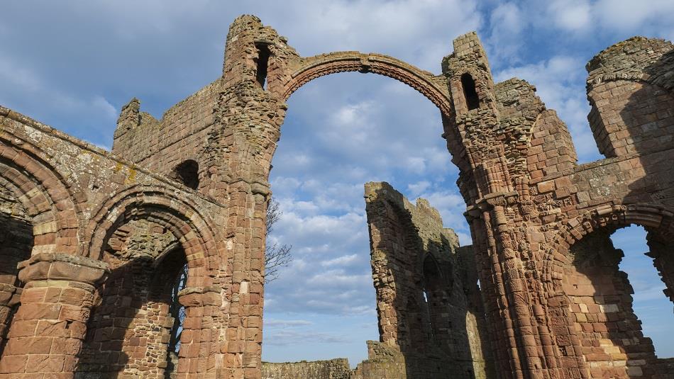 Image of Lindisfarne Priory on a sunny day - English Heritage.