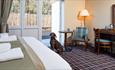 Image of a dog, in a cosy pet friendly bedroom at The Amble Inn.