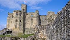 Exterior image of Warkworth Castle on a sunny day - English Heritage