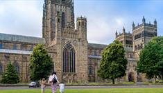 Family walking up to Durham Cathedral