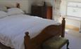 Comfortable double bedroom at Cragend Farm B&B, white bedding.